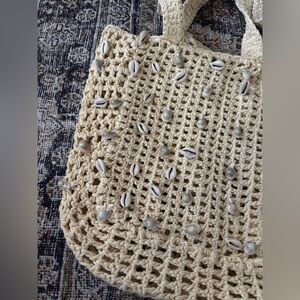 Cream crochet beach bag with shell details